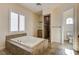 Well-lit bathroom showcasing a tiled tub, shower, and toilet area at 8490 Via De Bellasidra Ct, Las Vegas, NV 89123