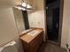 Bathroom with beige tile, glass shower, and modern vanity at 8490 Via De Bellasidra Ct, Las Vegas, NV 89123