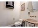 Powder room with vessel sink, stone countertop, bronze fixtures, and decorative accents at 8490 Via De Bellasidra Ct, Las Vegas, NV 89123