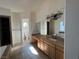 Bathroom with double vanity and a separate toilet area at 8490 Via De Bellasidra Ct, Las Vegas, NV 89123