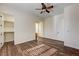 Bright bedroom with hardwood floors, a ceiling fan, and walk-in closet at 8490 Via De Bellasidra Ct, Las Vegas, NV 89123