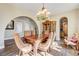 Charming dining room with hardwood floors and a large table perfect for Gathering gatherings at 8490 Via De Bellasidra Ct, Las Vegas, NV 89123