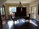 Formal dining room with large table, chandelier, and French doors at 8490 Via De Bellasidra Ct, Las Vegas, NV 89123