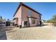 Back exterior view showing house, shed, and yard at 8490 Via De Bellasidra Ct, Las Vegas, NV 89123