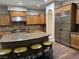 Spacious kitchen with island, stainless steel appliances, and granite countertops at 8490 Via De Bellasidra Ct, Las Vegas, NV 89123