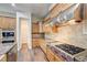 Kitchen with stainless appliances and granite counters, and a view of the cooktop and tile backsplash at 8490 Via De Bellasidra Ct, Las Vegas, NV 89123