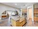 Spacious kitchen featuring custom cabinets, stone countertops, and stainless steel appliances at 8490 Via De Bellasidra Ct, Las Vegas, NV 89123