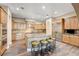 Well-equipped kitchen featuring a large island with seating, stainless steel appliances, and ample cabinetry at 8490 Via De Bellasidra Ct, Las Vegas, NV 89123