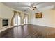 Bright living room with fireplace and access to an outdoor balcony at 8490 Via De Bellasidra Ct, Las Vegas, NV 89123