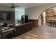 Spacious living room featuring hardwood floors and a view into the kitchen at 8490 Via De Bellasidra Ct, Las Vegas, NV 89123