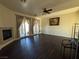 Bright living room with hardwood floors and access to a balcony at 8490 Via De Bellasidra Ct, Las Vegas, NV 89123