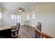 Upstairs loft with wood floors, seating, and many windows for plenty of light at 8490 Via De Bellasidra Ct, Las Vegas, NV 89123