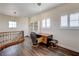 Cozy upstairs loft with desk, chair, and lots of natural light from two windows at 8490 Via De Bellasidra Ct, Las Vegas, NV 89123