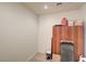 Unfinished storage room with cabinet and various household supplies at 8490 Via De Bellasidra Ct, Las Vegas, NV 89123