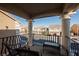 Relaxing balcony with wicker chairs and view of the neighborhood at 8543 Alpine Vineyards Ct, Las Vegas, NV 89139