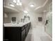 Elegant bathroom with a double vanity and a large soaking tub at 8543 Alpine Vineyards Ct, Las Vegas, NV 89139