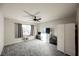 Bright bedroom with ceiling fan, carpeting, and room darkening curtains at 8543 Alpine Vineyards Ct, Las Vegas, NV 89139