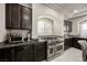 Modern kitchen with stainless steel range and granite countertops at 8543 Alpine Vineyards Ct, Las Vegas, NV 89139