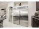 Modern kitchen with large stainless steel refrigerator at 8543 Alpine Vineyards Ct, Las Vegas, NV 89139