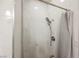 Clean shower with marble tile and dual shower heads at 8543 Alpine Vineyards Ct, Las Vegas, NV 89139