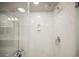 Clean shower with glass enclosure and marble-style walls at 8543 Alpine Vineyards Ct, Las Vegas, NV 89139