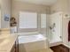 Bathroom with garden tub, separate shower, and window at 9240 Long Grove Ave, Las Vegas, NV 89149