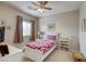 Bedroom with twin bed, dresser, and ceiling fan at 9240 Long Grove Ave, Las Vegas, NV 89149