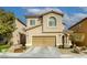 Two-story house with attached garage and landscaping at 9240 Long Grove Ave, Las Vegas, NV 89149