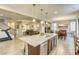 Kitchen with island, stainless steel appliances and view to living room at 9240 Long Grove Ave, Las Vegas, NV 89149