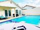 Home with a refreshing blue swimming pool and patio furniture at 9366 W Viking Rd, Las Vegas, NV 89147