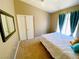 Spacious bedroom with a double bed and mirrored closet doors at 9366 W Viking Rd, Las Vegas, NV 89147