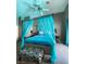 Bright bedroom with canopy bed and turquoise accents at 9366 W Viking Rd, Las Vegas, NV 89147