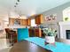 Kitchen dining area with teal accents and modern light fixtures at 9366 W Viking Rd, Las Vegas, NV 89147