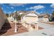 House exterior with a landscaped yard and driveway at 9366 W Viking Rd, Las Vegas, NV 89147