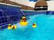 Three solar powered ducks in a refreshing blue swimming pool at 9366 W Viking Rd, Las Vegas, NV 89147