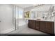 Elegant bathroom with double vanity, soaking tub, and walk-in shower at 9656 Biedler Ct # Lot 7, Las Vegas, NV 89178