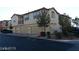 Tan two-story townhome with attached garage and driveway at , Las Vegas, NV 89118