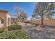 Landscaped backyard with gravel, shrubs, and trees at 10009 Hemet Dr, Las Vegas, NV 89134