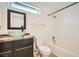This bathroom features a glass vessel sink, granite countertop, and a shower over a bathtub with a white tile surround at 10009 Hemet Dr, Las Vegas, NV 89134