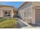 Front view of house with walkway, landscaping, and two-car garage at 10009 Hemet Dr, Las Vegas, NV 89134