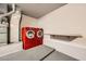 This laundry room features a full size, high-efficiency red washer and dryer set, and a folding table at 10009 Hemet Dr, Las Vegas, NV 89134