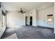 Bright and airy living room with carpet flooring and ceiling fan at 10009 Hemet Dr, Las Vegas, NV 89134