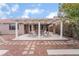 Backyard patio with pergola and seating area at 10134 Donald Weese Ct, Las Vegas, NV 89129