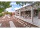 Backyard patio with pergola, seating, and fire pit at 10134 Donald Weese Ct, Las Vegas, NV 89129