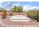 Landscaped backyard with fire pit and seating at 10134 Donald Weese Ct, Las Vegas, NV 89129