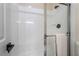 Clean bathroom with a shower/tub combo and white tile at 10134 Donald Weese Ct, Las Vegas, NV 89129