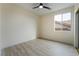 Simple bedroom with wood-look floors and a window with a view at 10134 Donald Weese Ct, Las Vegas, NV 89129