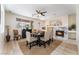 Elegant dining room with fireplace and large window at 10134 Donald Weese Ct, Las Vegas, NV 89129