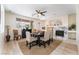 Elegant dining room with fireplace and large window at 10134 Donald Weese Ct, Las Vegas, NV 89129