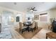 Bright dining room with a rustic wooden table and neutral decor at 10134 Donald Weese Ct, Las Vegas, NV 89129